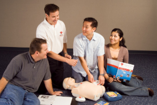 Students practice CPR under instruction