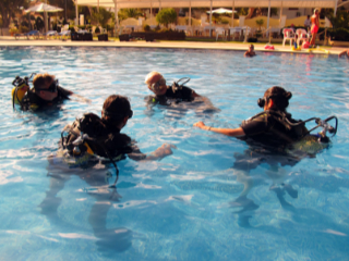 Divers learning in the pool
