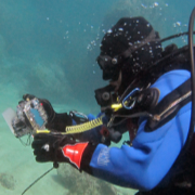 Diver prepares camera at Cala Cortina
